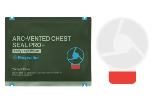 Arc-vented chest seal beside a sterile foil pouch